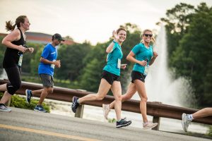 Runners Smile Waving